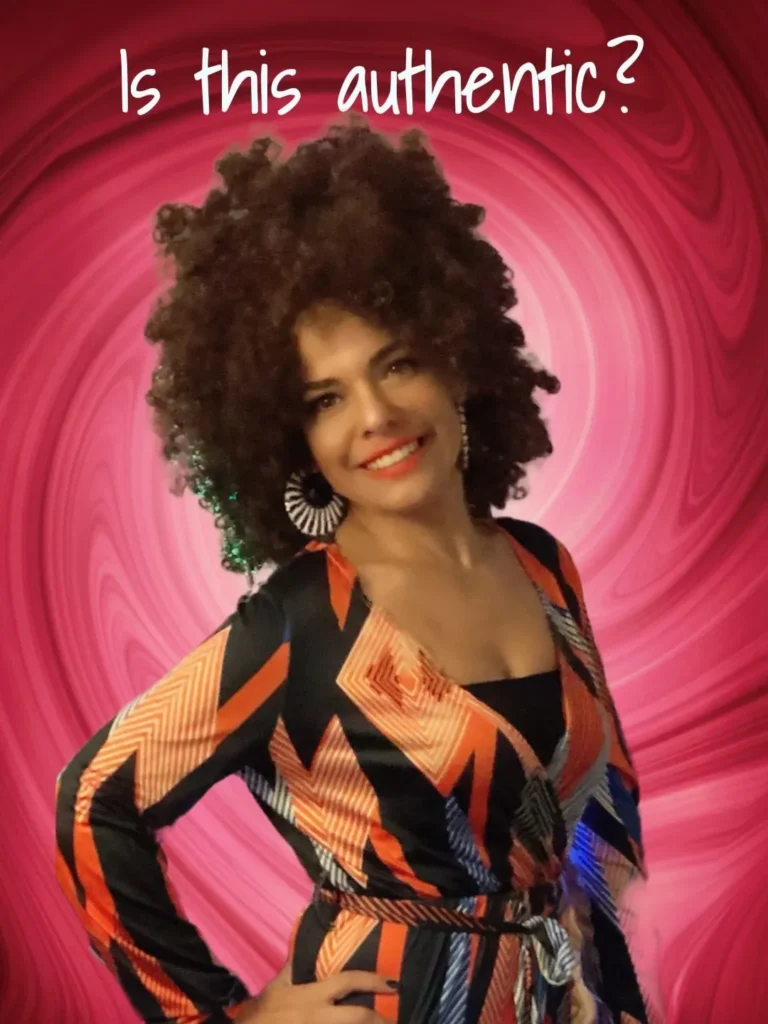 A woman with afro hair posing for the camera.