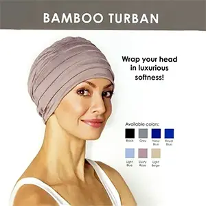 A woman wearing a bamboo turban with different colors of fabric.