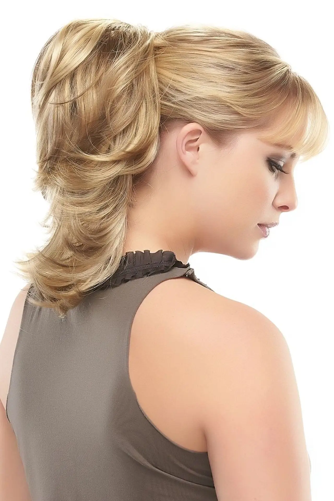 A woman with blonde hair is wearing a dress