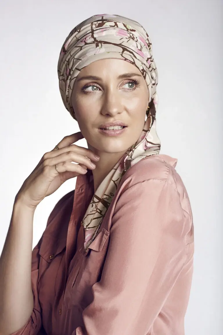 A woman with a head scarf on her head.