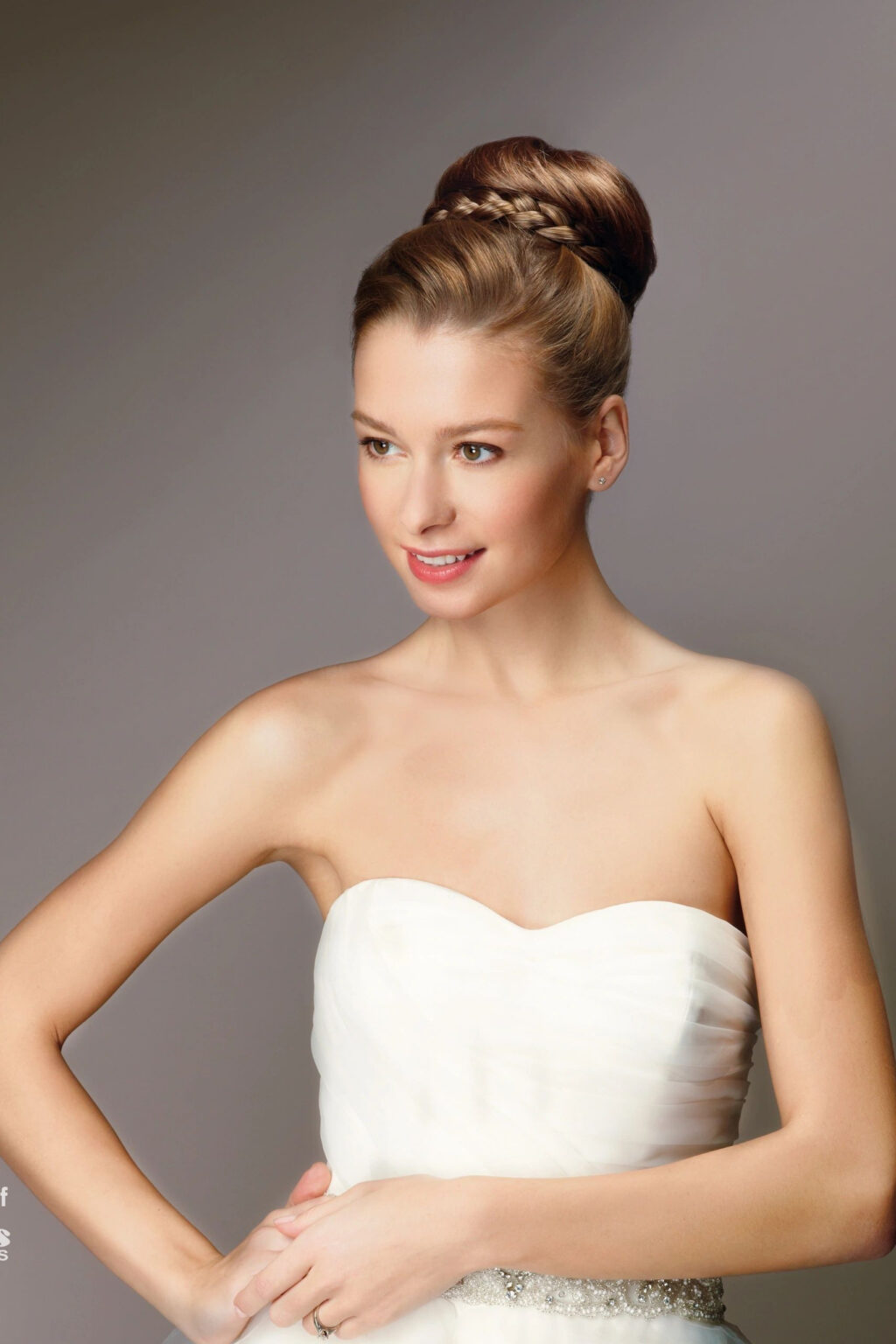 A woman in white dress posing for the camera.