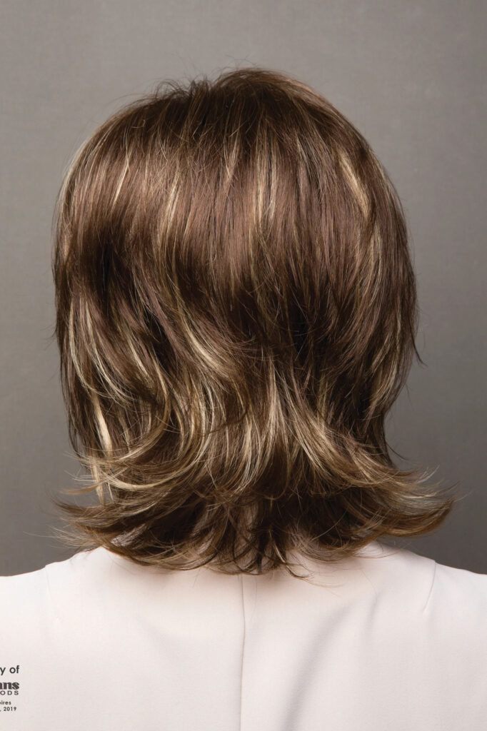 A woman with long hair is wearing white shirt