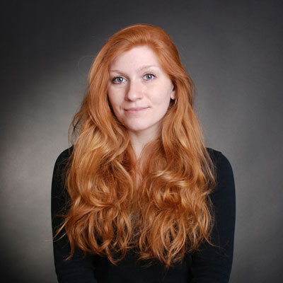 portrait-young-woman-against-gray-background